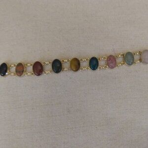 Gold tone scarab multi color faux stones bracelet.